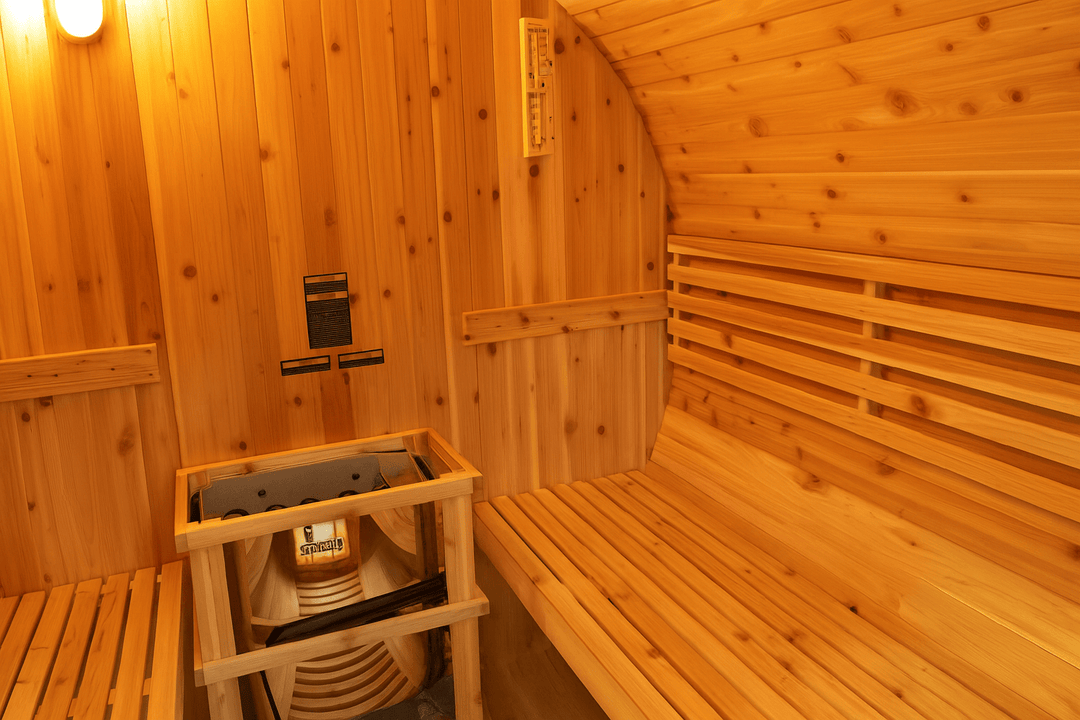 Interior of SunRay barrel sauna designed for 2-4 person outdoor sauna experience with wooden benches
