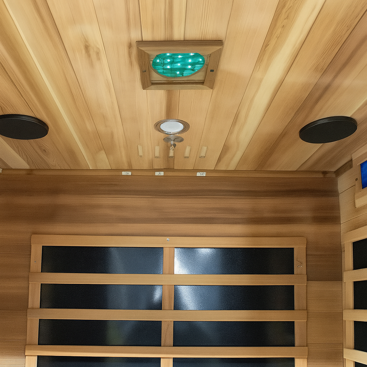 Interior view of SunRay 2-person cedar sauna with wooden benches and infrared panels