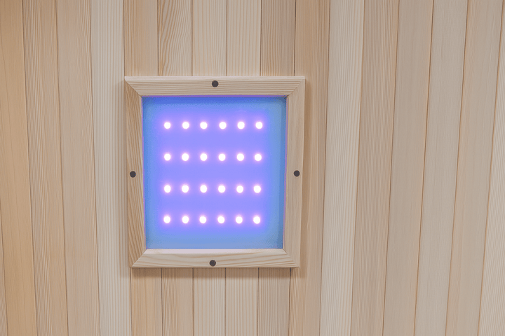 Interior view of a SunRay 2-person cedar sauna with LED lighting panel for a soothing atmosphere