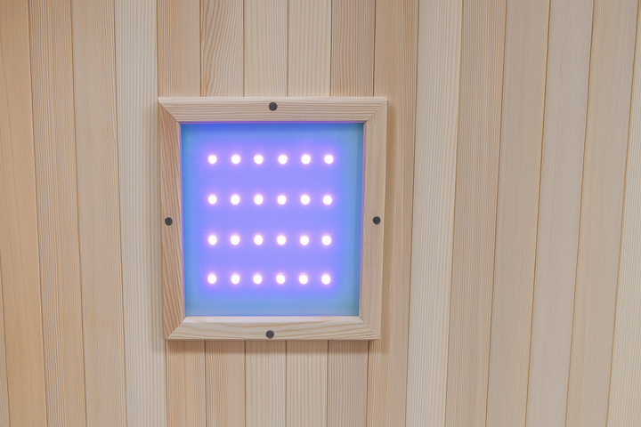 Interior LED control panel light inside SunRay 2-person cedar sauna with natural wood walls