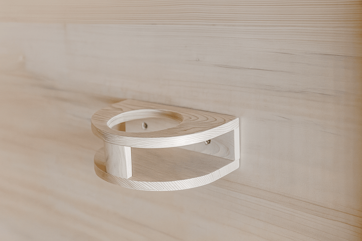 Close-up of a wooden shelf in a SunRay 3-person indoor sauna for towels or drinks