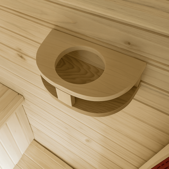 Inside view of a SunRay 3-person outdoor infrared sauna with wooden cup holder shelf
