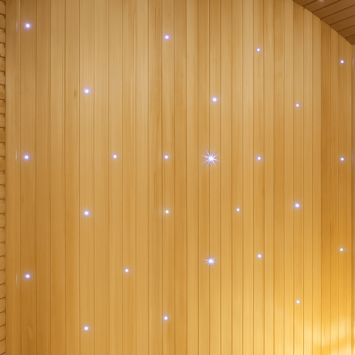 Interior view of a SunRay 3-person traditional sauna with warm wooden panels and ambient lighting