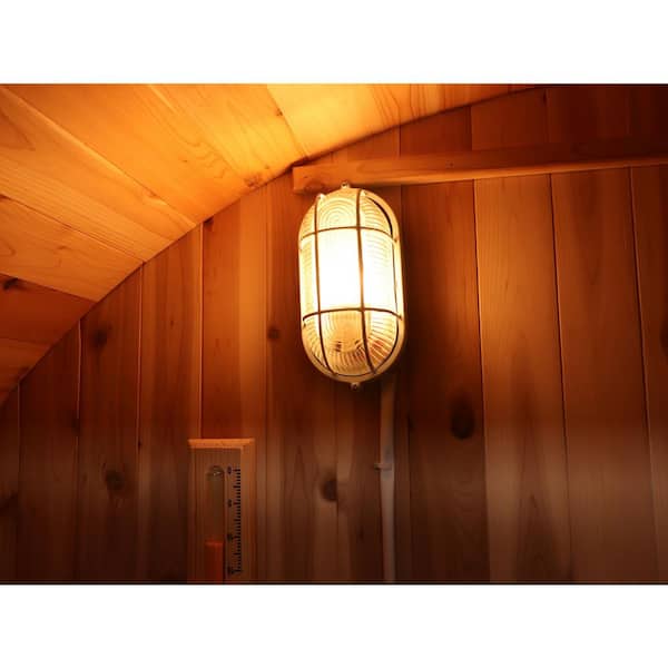 Interior view of a SunRay 4-person barrel sauna featuring warm lighting and wooden paneling