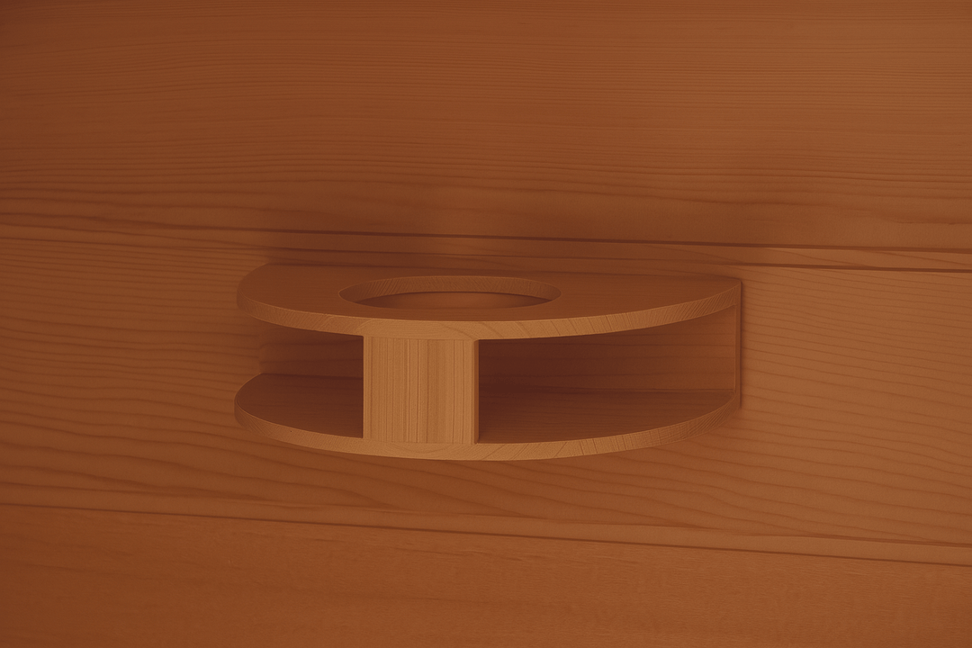 Interior view of SunRay 4-person infrared cedar sauna with a wooden cup holder