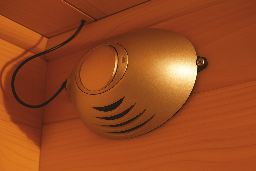 Interior detail of a SunRay 4-person infrared cedar sauna with sleek speaker system design