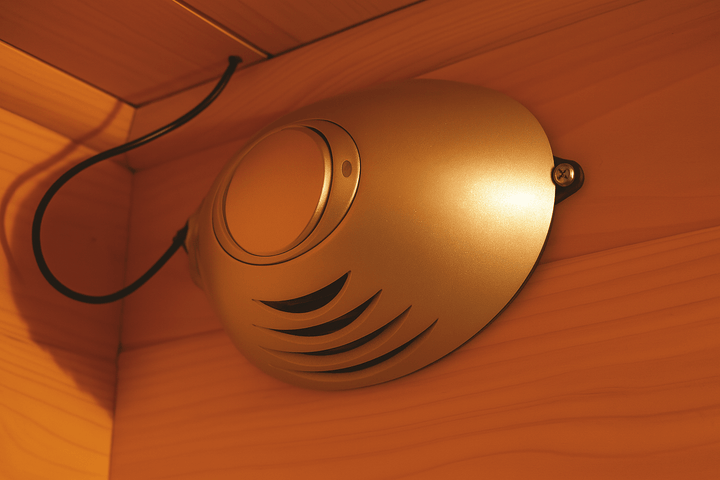 Interior detail of a SunRay 4-person infrared cedar sauna with sleek speaker system design