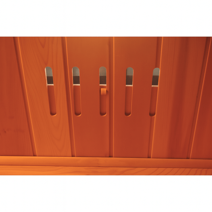 Interior view of SunRay 4-person infrared cedar sauna with wooden slats and ventilation panels