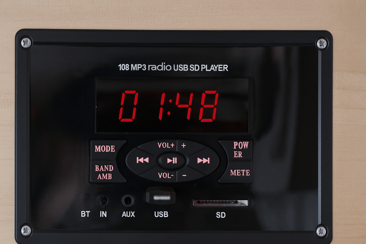 Control panel of a 4-person infrared sauna featuring MP3, USB, and SD player options