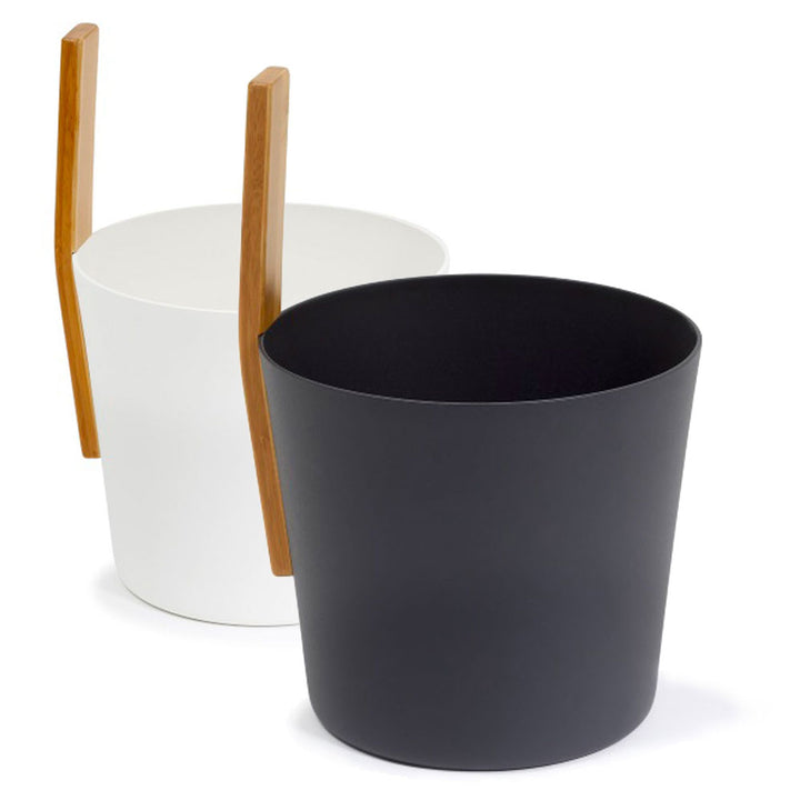KOLO sauna accessories featuring black and white buckets with wooden handles for sauna use