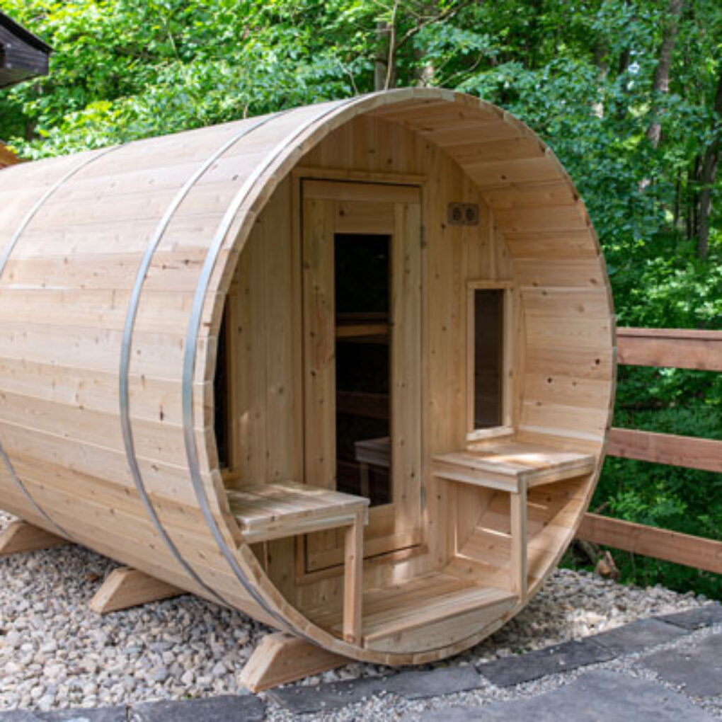 Leisurecraft backyard barrel sauna for sale made of natural wood in a round barrel shape with front benches