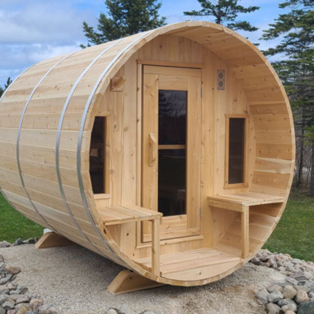 Leisurecraft Backyard Barrel Sauna for Sale made of natural wood with front door and windows outdoors