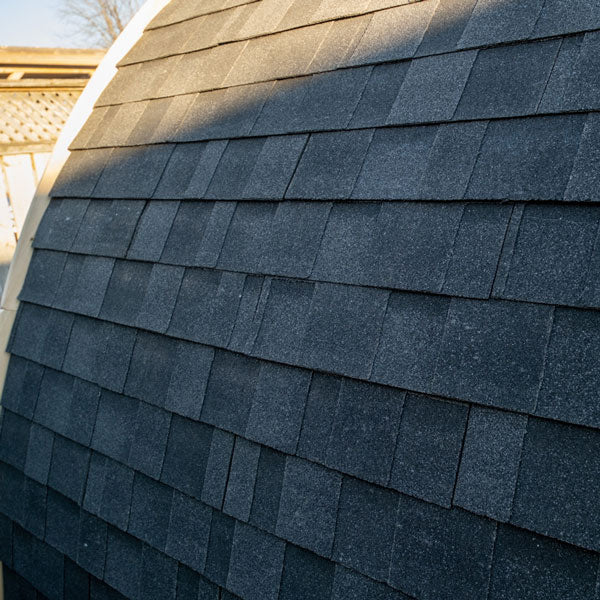 Close-up of textured gray shingle roofing on a traditional Leisurecraft sauna for backyard saunas for homes