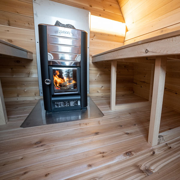 Leisurecraft traditional sauna interior with wood stove for backyard saunas for homes