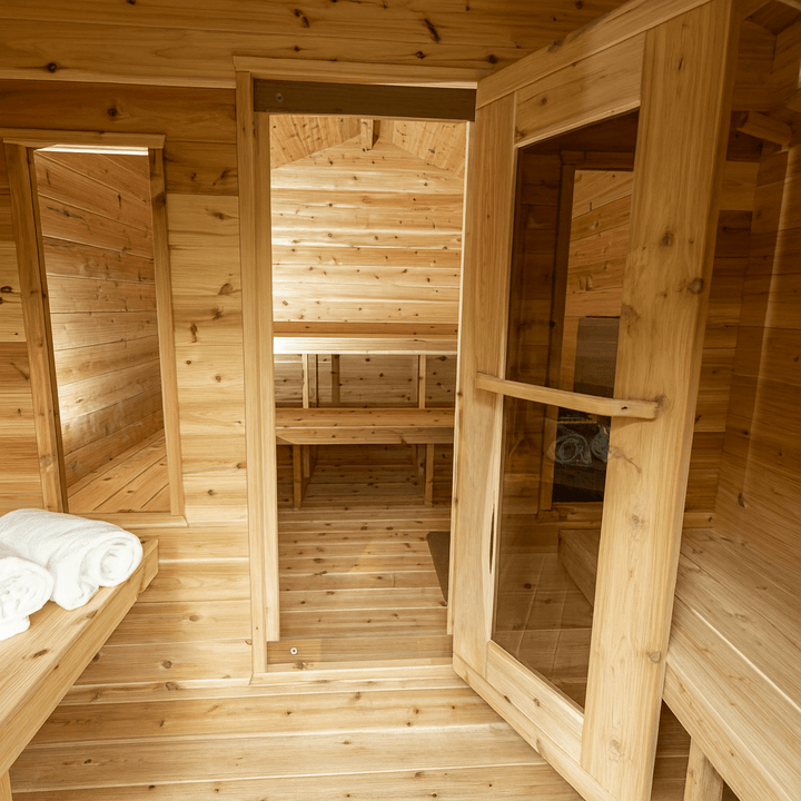 Interior of a Canadian Timber Georgian cabin sauna with wooden benches and natural light