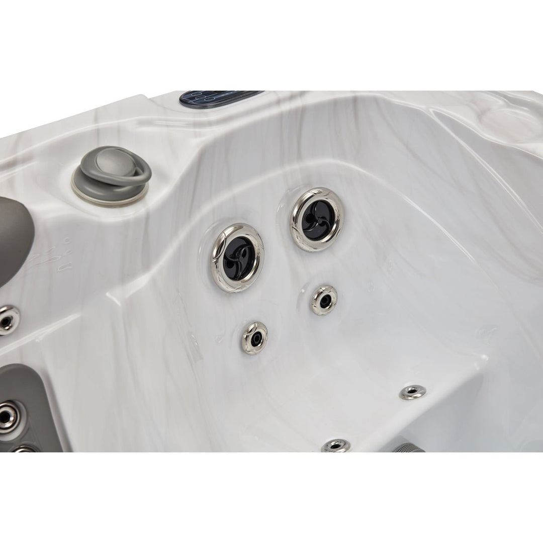 Luxury Spa Casey Elite hot tub with elegant marble design and multiple massage jets for ultimate relaxation