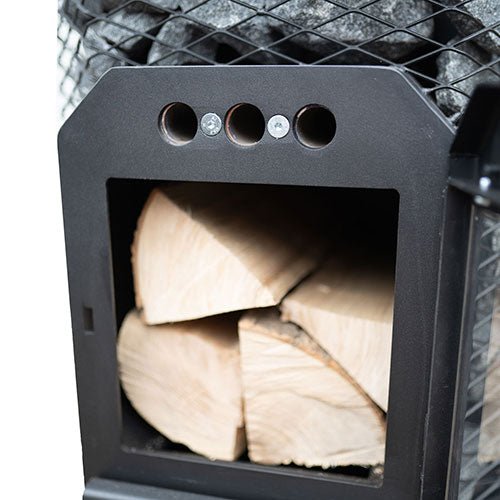 Cozy Heat thru-wall sauna stove with a wood storage compartment and heat resistant design