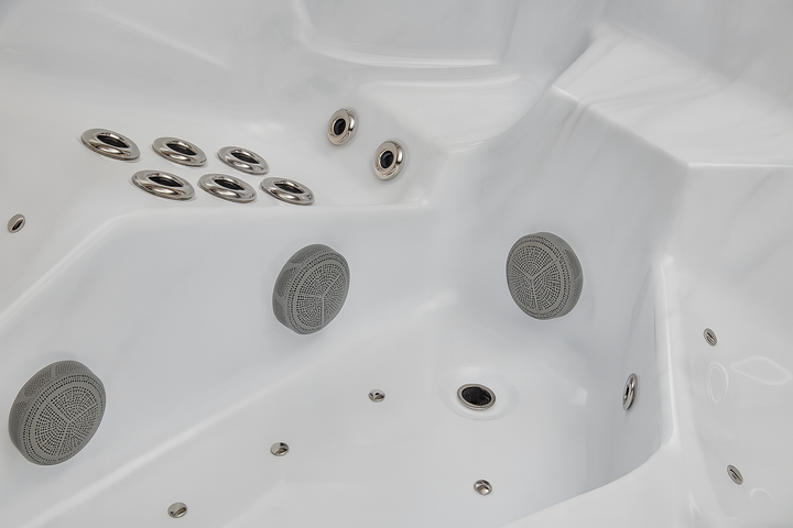Close-up of white Danika Elite spa tub interior with multiple water jets and built-in speakers