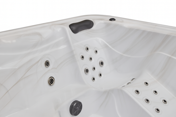White interior of Luxury Spa Eclipse Studio Series hot tub with multiple jets and a headrest