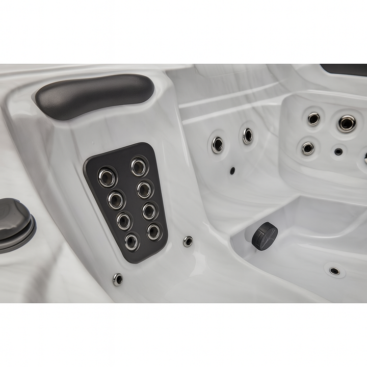 Luxury Spa Estes Studio Series spa white hot tub with multiple jet nozzles and cushioned headrest