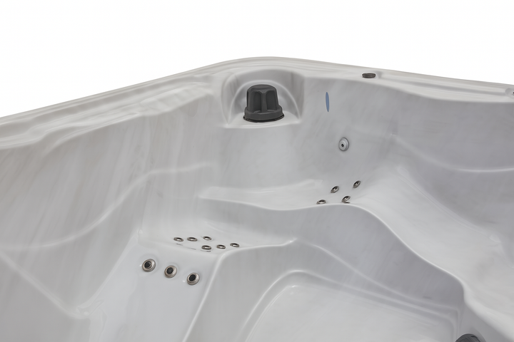 Close-up of white Estes Studio Series spa hot tub interior with multiple jet nozzles by Luxury Spa