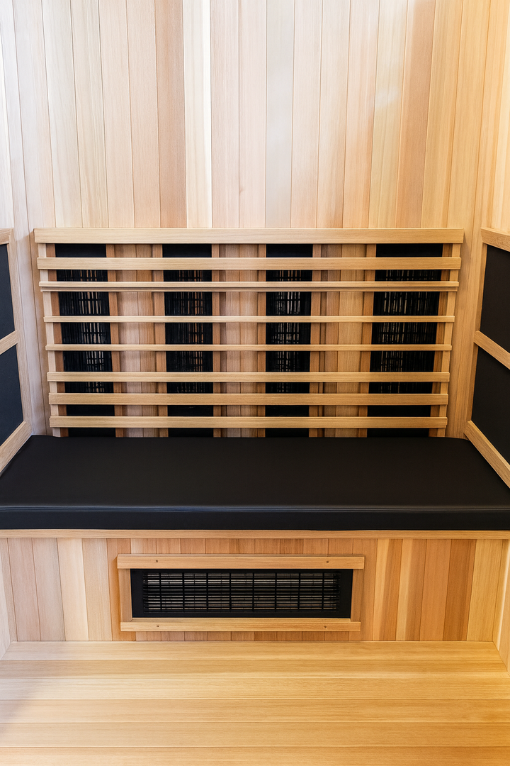 Finnmark FD-5 sauna cushion placed on wooden sauna bench inside a wood-paneled sauna room