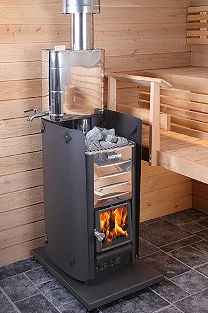Harvia 26 Pro sauna heater wood-burning stove with metal chimney and sauna stones inside wooden sauna room