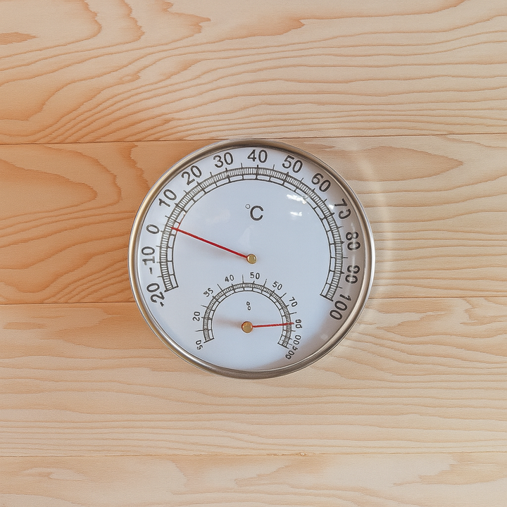 Temperature and humidity gauge inside SunRay 3-person outdoor sauna with wooden interior walls