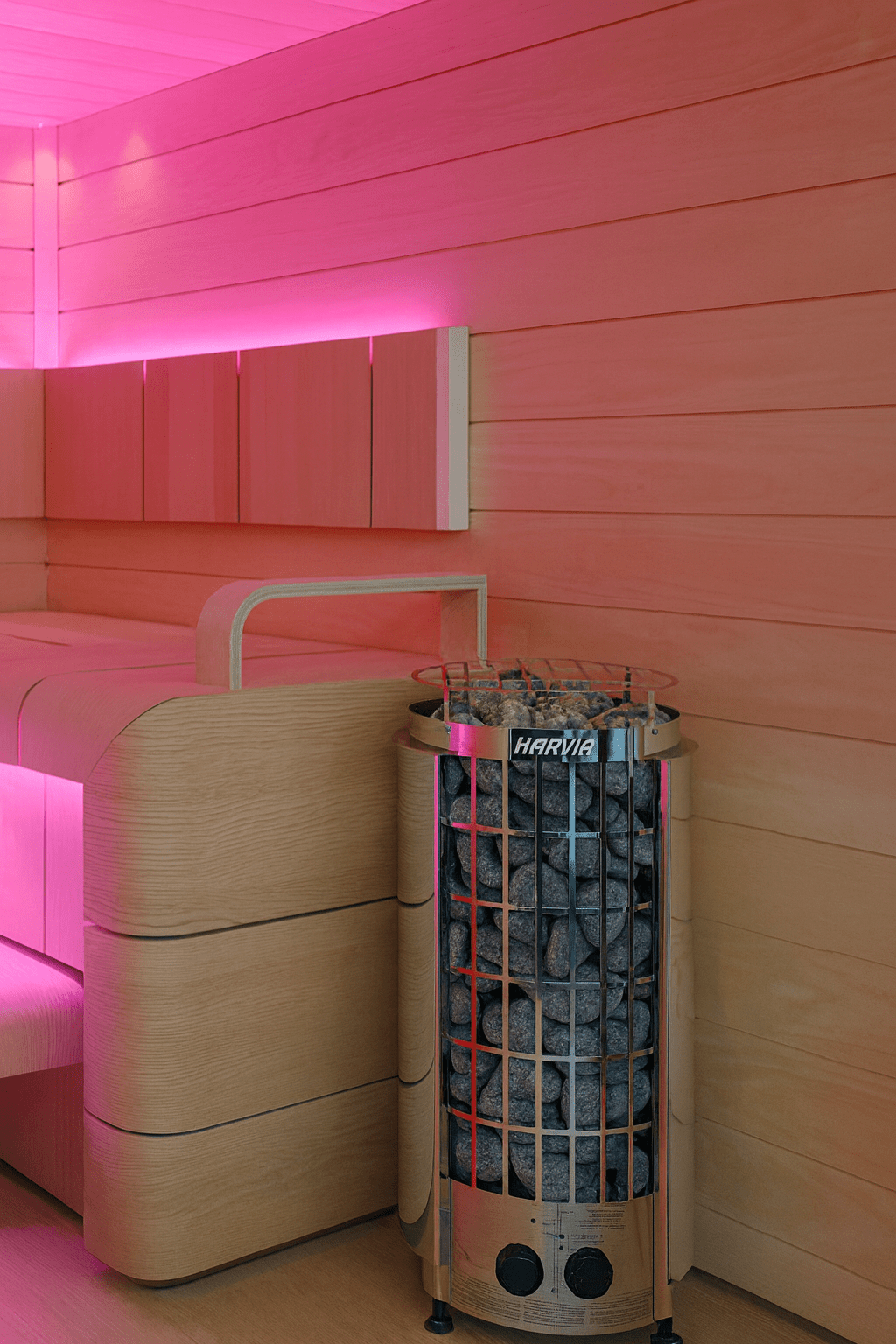 Harvia Cilindro PC90 sauna heater with stones in a stylish sauna interior with soft lighting