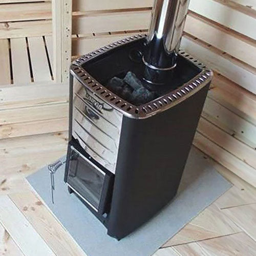 Harvia M3 wood burning sauna stove black metal body stainless front and stones on top with chimney in wooden sauna