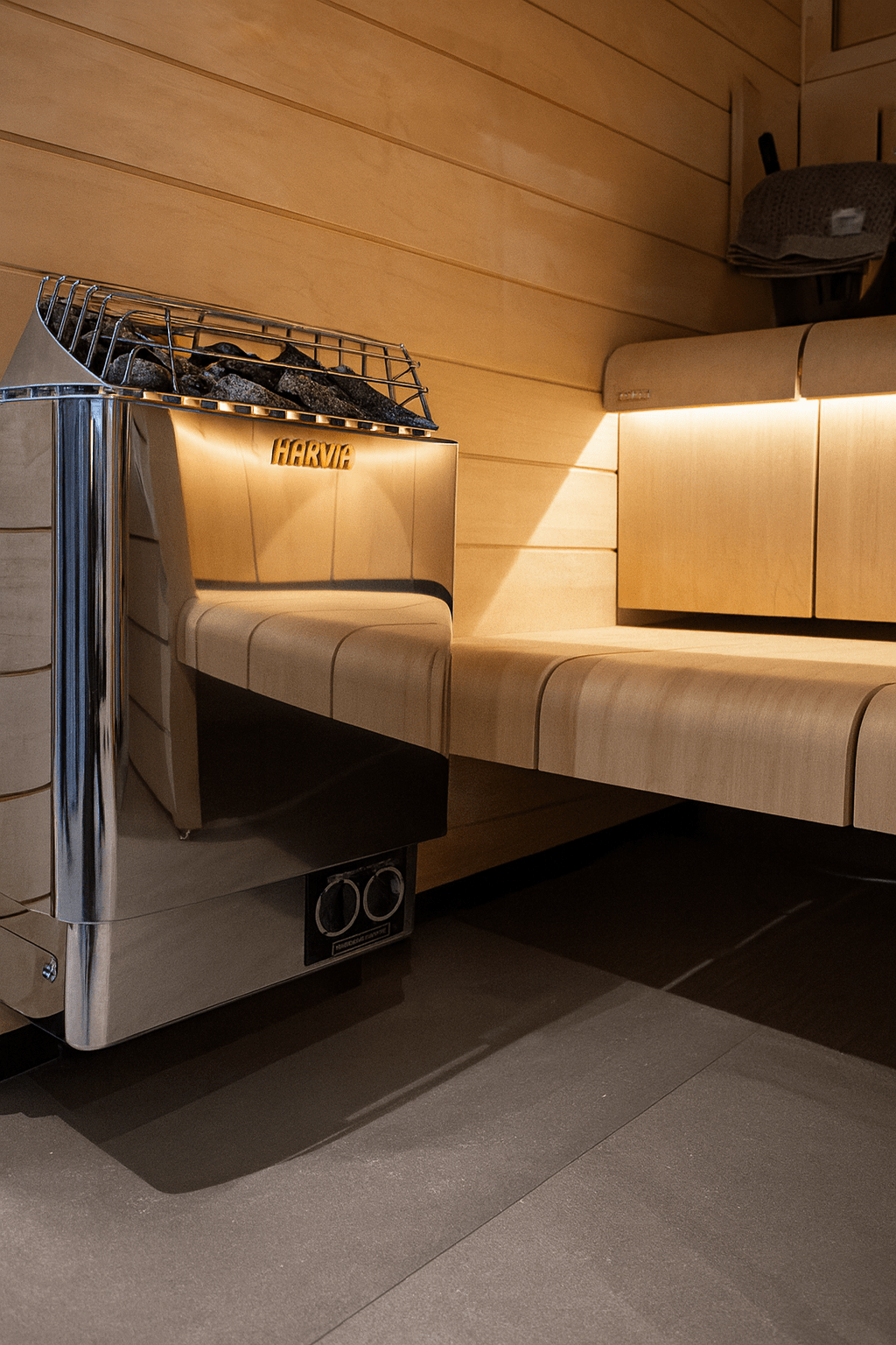 Harvia KIP30B electric sauna heater with sleek design installed in a wooden sauna room