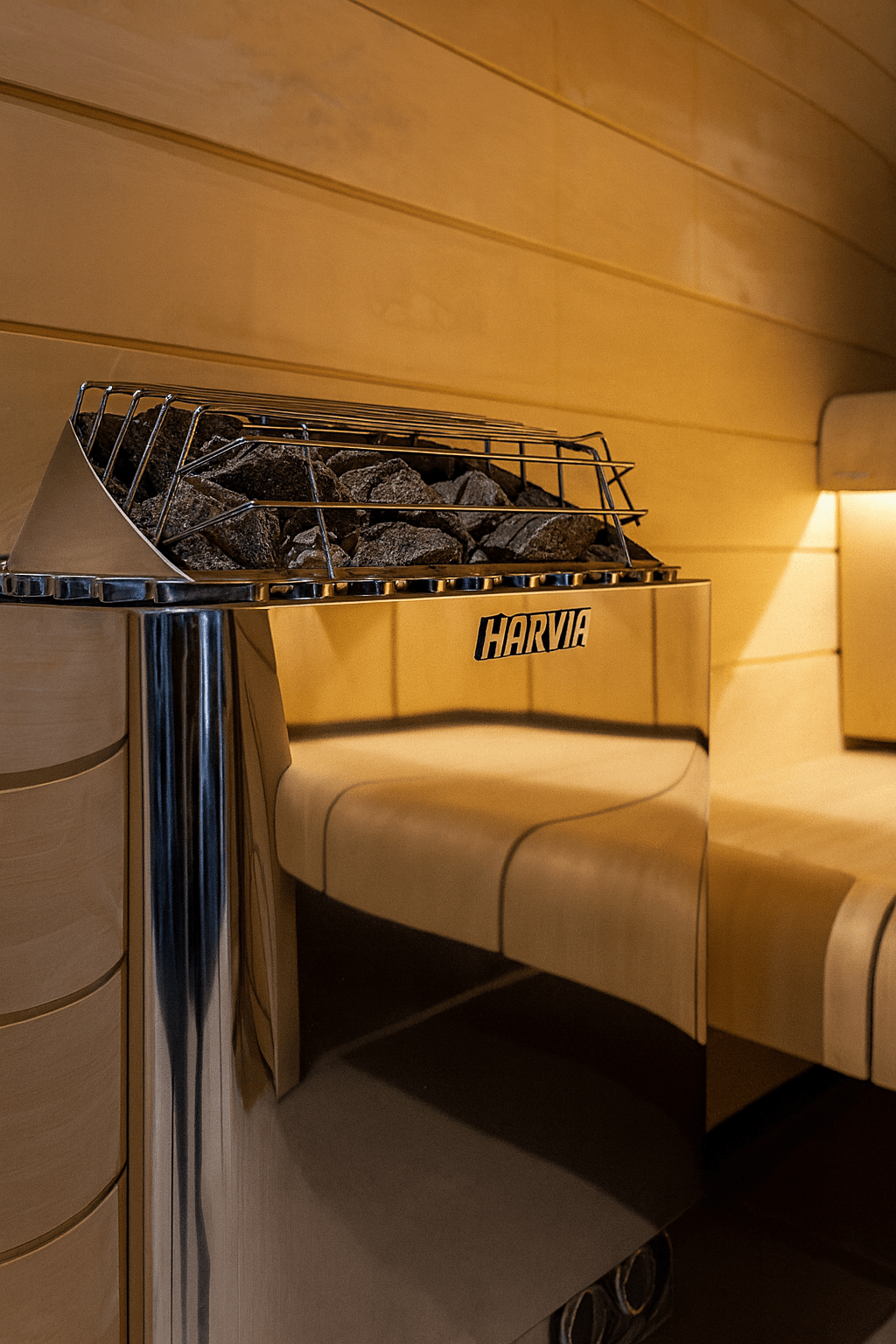 Harvia KIP30B electric sauna heater with polished stainless steel design and rock tray for optimal heating
