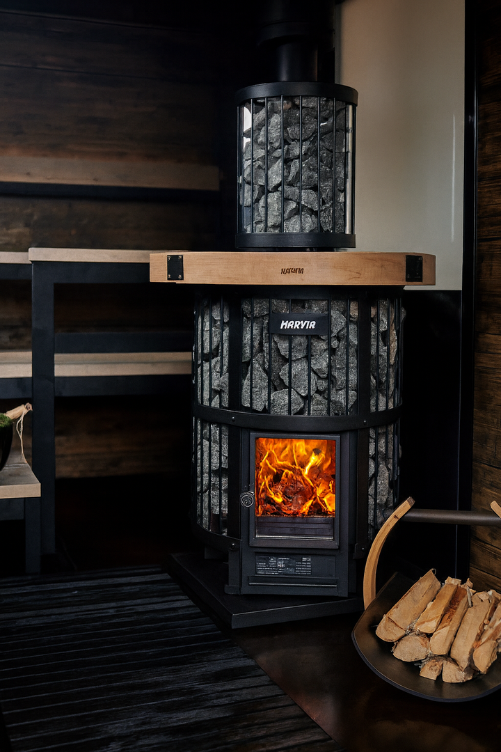 Harvia Legend 240GF sauna heater with visible fire and sauna stones in modern wooden sauna room
