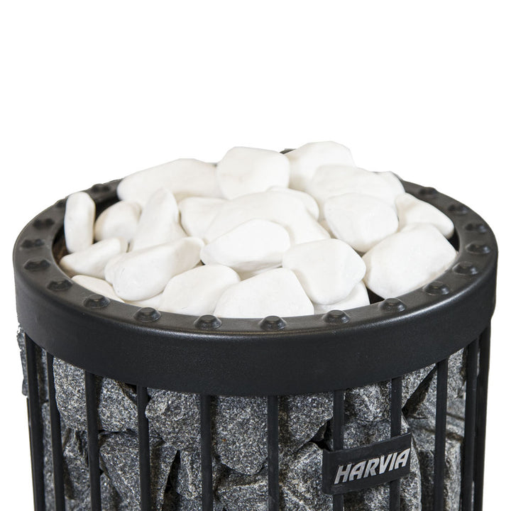 Harvia sauna heater filled with white decorative sauna stones on top for enhanced sauna experience