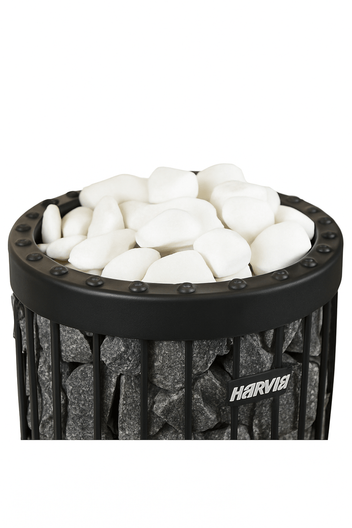 Harvia decorative sauna stones in white atop a dark sauna heater for a stylish look