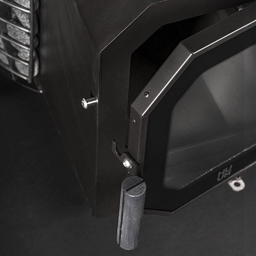 HUUM black wood burning sauna stove close-up showing handle and door details
