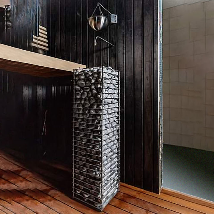 HUUM CLIFF 9kW electric sauna heater tower filled with sauna stones in modern wooden sauna room