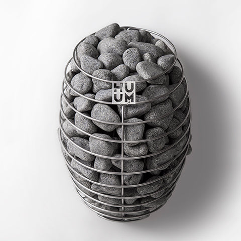 HUUM DROP 4.5kW sauna heater with oval metal frame filled with sauna stones on white background