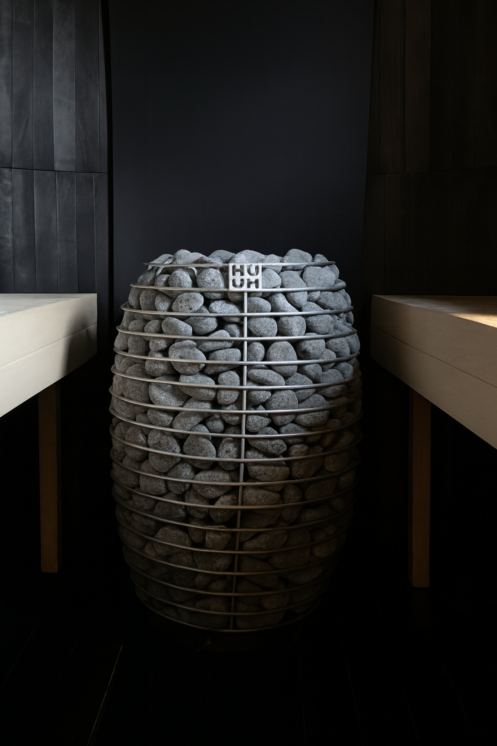 HUUM HIVE sauna heater 15kW with cage design filled with sauna stones in modern sauna interior