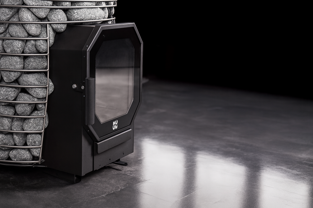 HUUM black metal sauna heater with stones on top in modern sauna room home sauna heater package