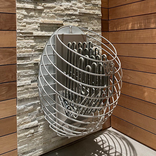 HUUM DROP 4.5kW sauna heater wall mounted stainless steel cage with exposed coil elements in wood sauna