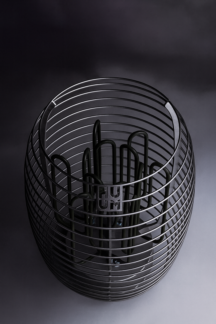 HUUM HIVE Series sauna heater in black open cage design showing internal heating elements and HUUM logo