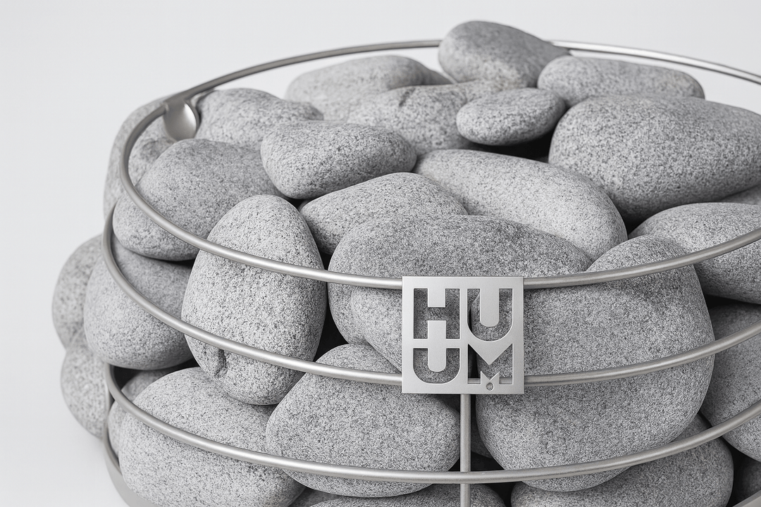 HUUM sauna heater stones in a sleek metal bowl for optimal sauna performance and luxury experience