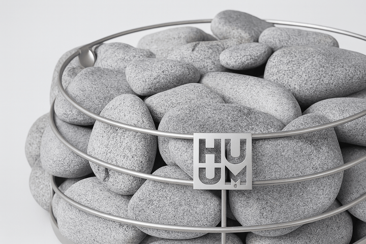 HUUM sauna heater stones in a sleek metal bowl for optimal sauna performance and luxury experience