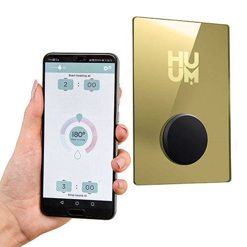 HUUM UKU Gold sauna control accessory with sleek gold finish and smartphone app interface