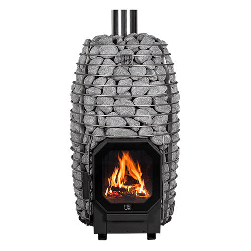 HUUM wood burning sauna stove with stone enclosure and visible fire inside heating chamber