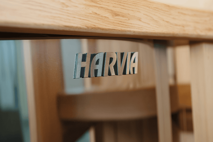 Harvia logo on a wooden bench of an indoor traditional sauna for home by SunRay