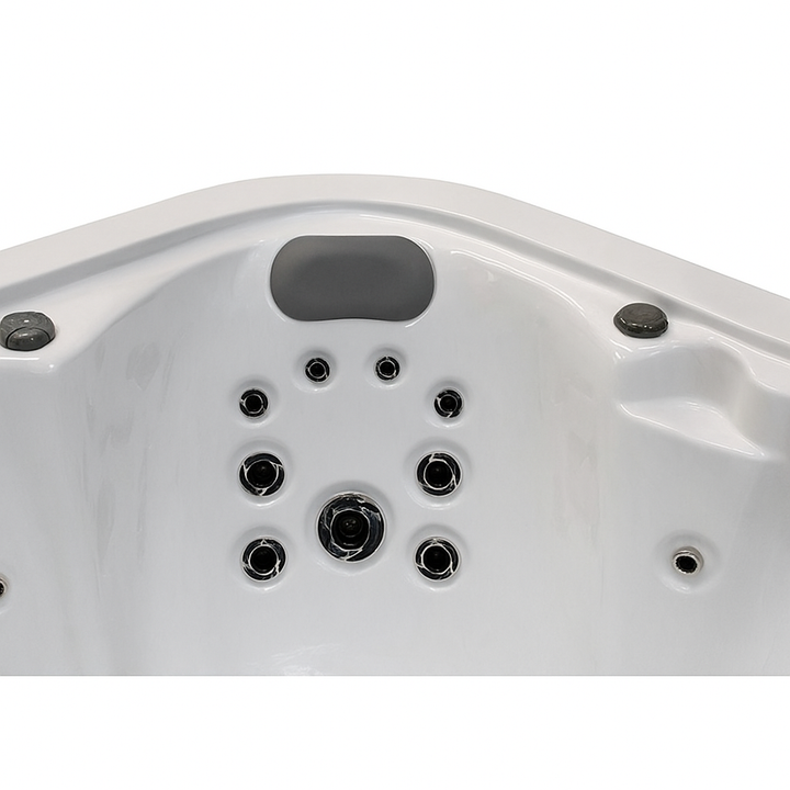 Close-up view of white Infinity Elite Series hot tub seat with multiple jet nozzles and headrest