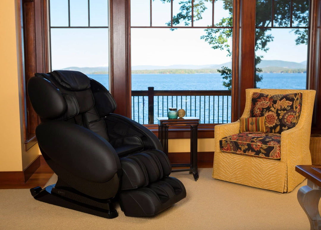 Infinity IT-8500 Plus massage chair in a cozy setting with a view of the lake