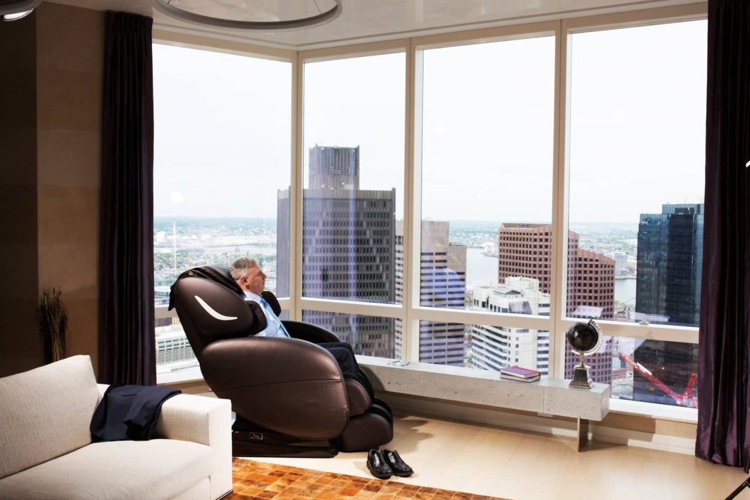 Infinity Smart Chair X3 massage chair in a modern living room with city view offering relaxation features